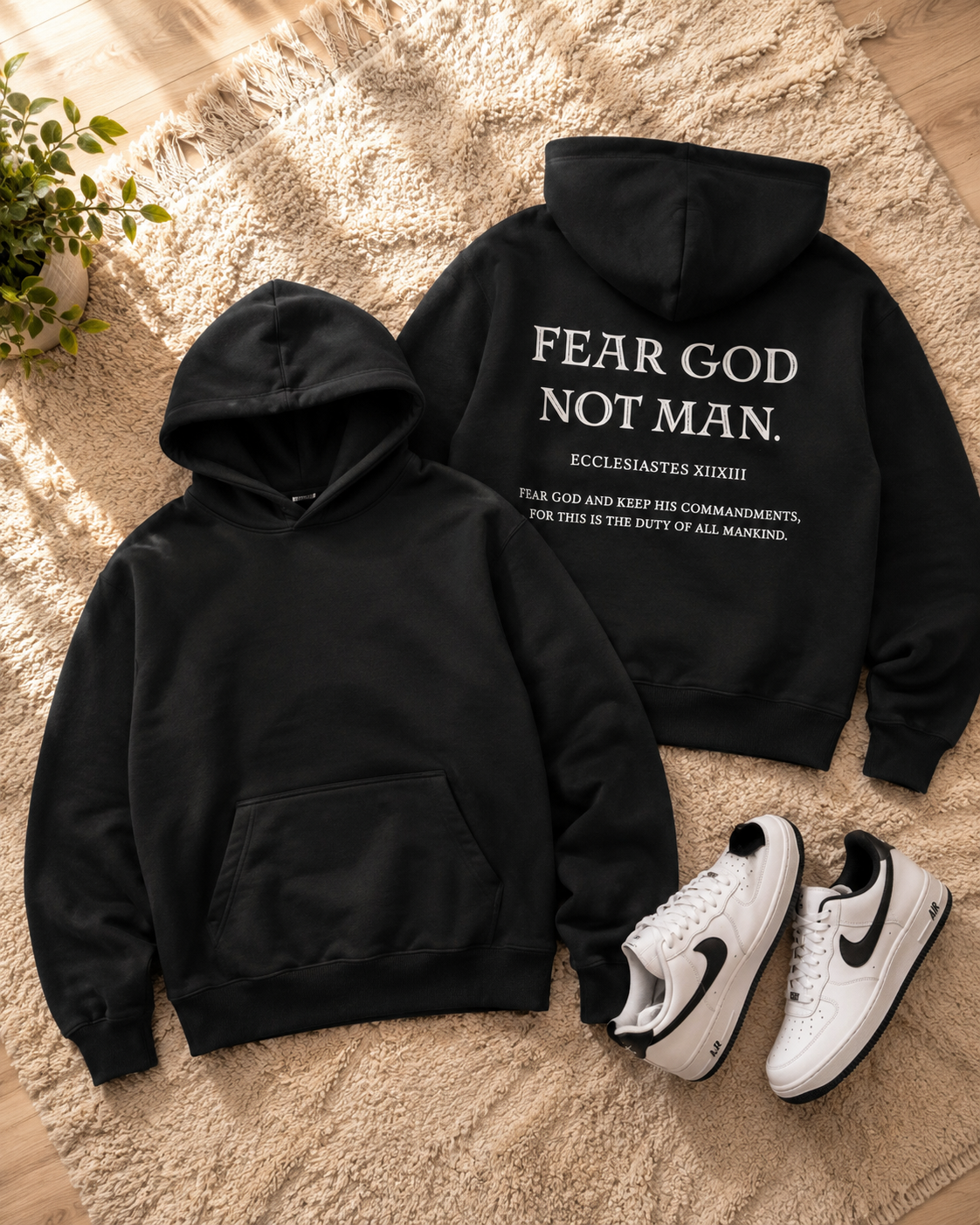 Fear God Not Man Hoodie in black flat lay